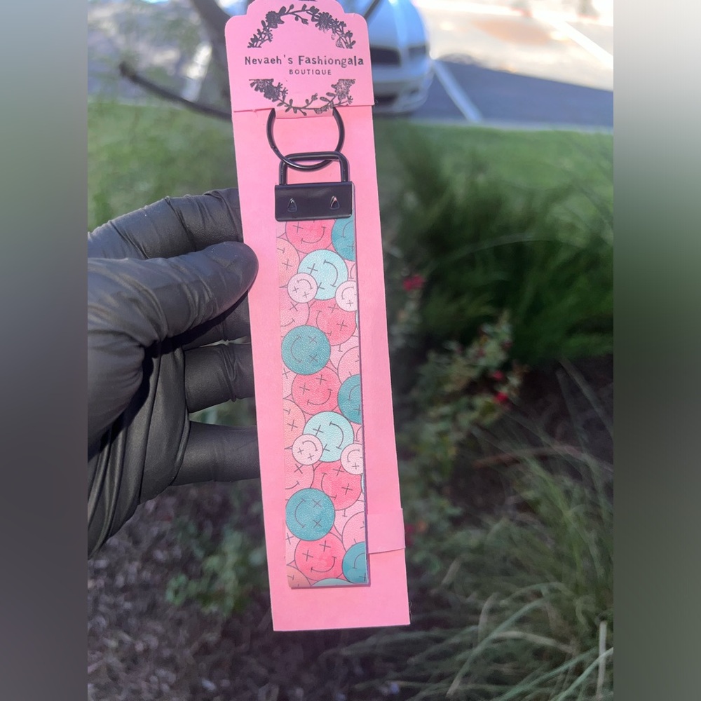 SOLD! 
Black key fobe wristlet Keychain with light glitter pink on the inside